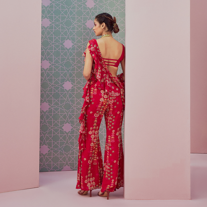 Sequence blouse paired with red ruffle saree drape